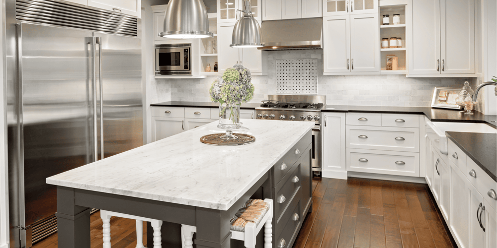 Stock Image of New Kitchen with Marble Island and Black Perimeter Counters