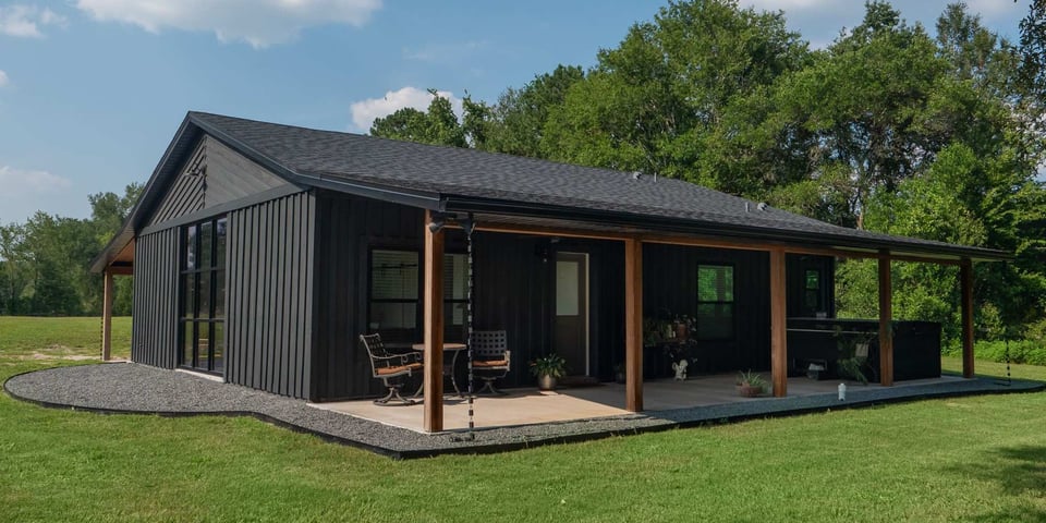 Image of a black ADU with a porch in Gainesville, Fl by Robinson Renovation and Custom Homes