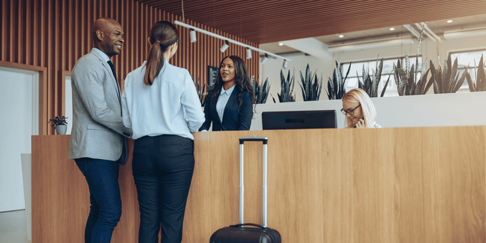 Stock Image of Couple Checking in Luxury Homes