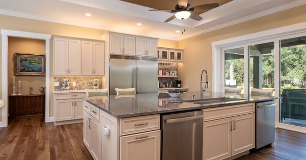 Spacious kitchen remodel with quartz island and stainless appliances in Gainesville by Robinson Renovation