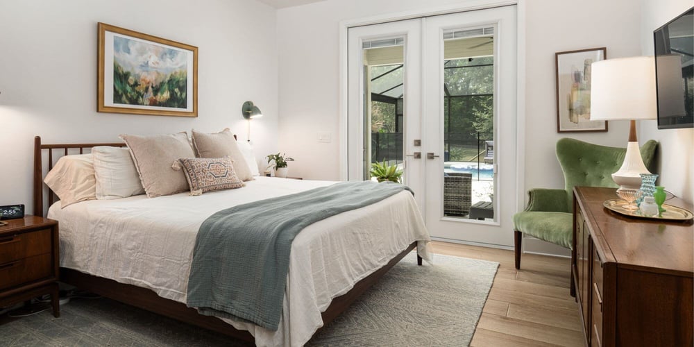 Bedroom with French Doors to Enclosed Pool in ADU in Gainesville