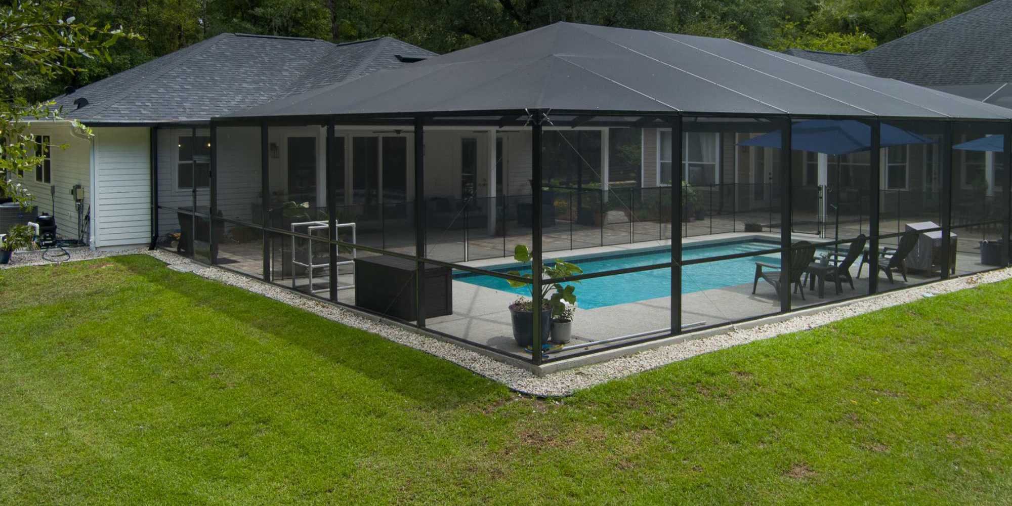ADU with screen enclosed pool beside the main house by Robinson Renovation & Custom Homes in Alachua County, FL