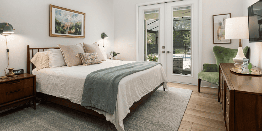 Custom Bedroom with Double Doors Out to Patio and Covered Pool in Gainesville