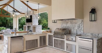 High-end outdoor kitchen in Gainesville featuring granite countertops and grill
