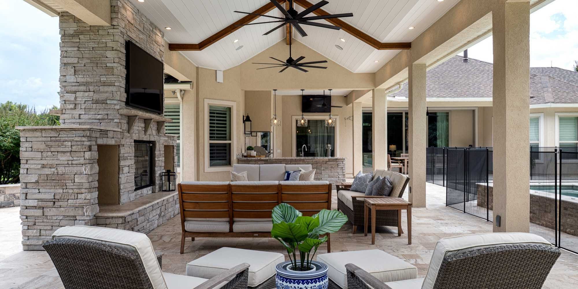 Modern outdoor kitchen and living area by RRCH in Gainesville