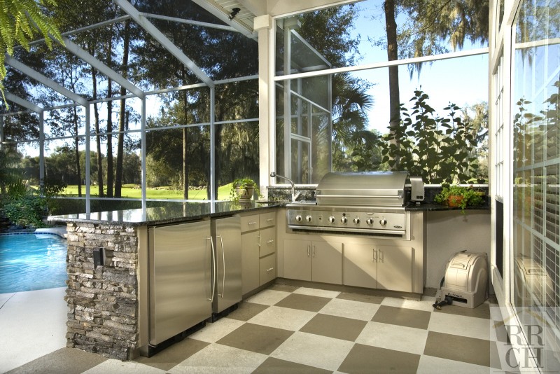 Outdoor kitchen overlooking pool - Robinson Renovations - Gainesville Fl Design Build Remodeler and Custom Home Builder - best materials for outdoor kitchens