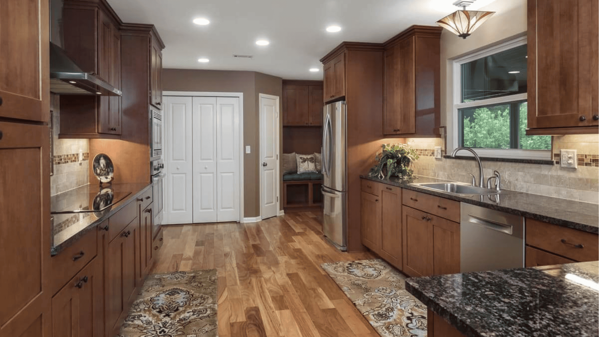 Rustic-style wooden kitchen featuring stainless steel appliances - Robinson Renovations - Gainesville Fl Design Build Remodeler and Custom Home Builder 