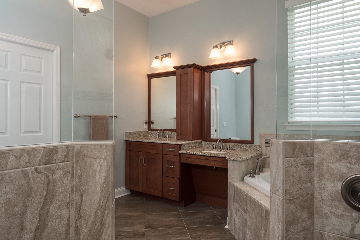 Natural Stone Walk-In Shower and Countertops Vanity Sinks River Run - Robinson Custom Homes & Renovations - Gainesville FL - Timeless Designs