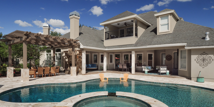 Outdoor oasis Florida featuring pool, pergola, and outdoor living area- Urban Infill - Pensacola Luxury Custom Home Builder and Remodeler