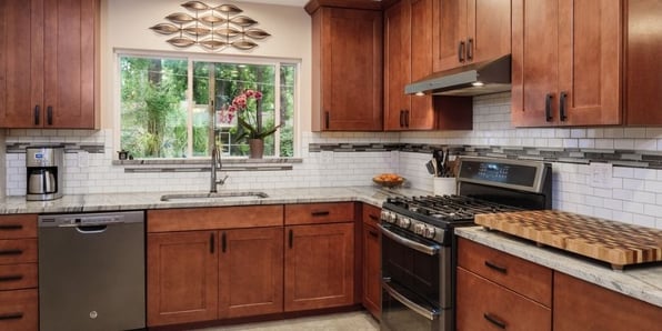 Wooden Kitchen Cabinetry with Stainless Steel Appliances 