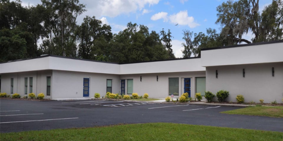 Renovated commercial building in Gainesville, FL by RRCH featuring clean lines and contemporary exterior