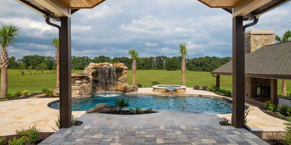 Outdoor oasis water features in a remodel by RRCH in Gainesville, FL