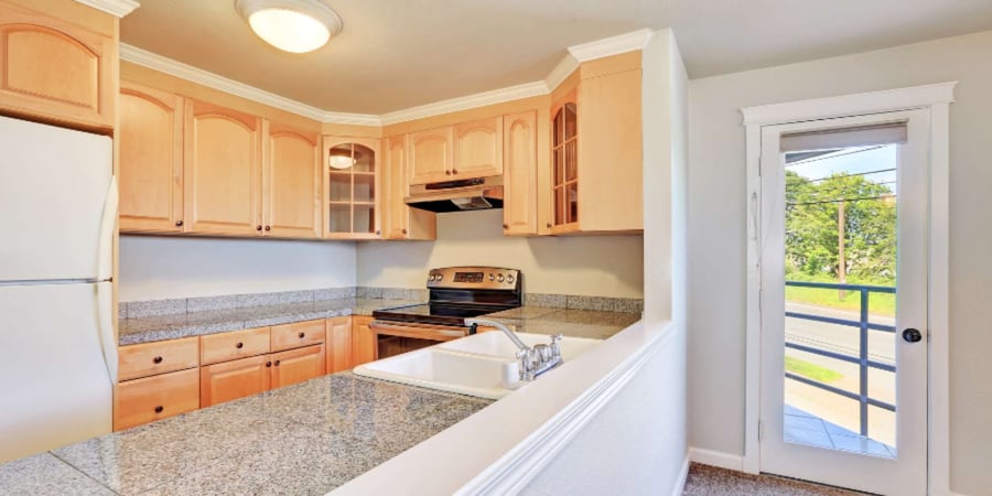 Gainesville kitchen remodel with maple raised panel cabinetry and granite counters by Robinson Renovation