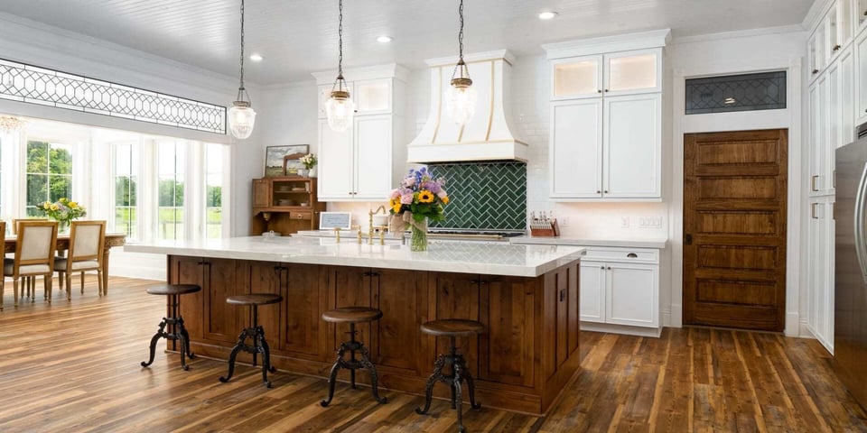 Kitchen with Natural Wood and Sunroom Dining Area by Robinson Renovations and Custom Homes