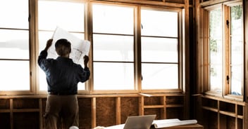 Looking at blueprints of a whole home remodel in Gainesville, FL