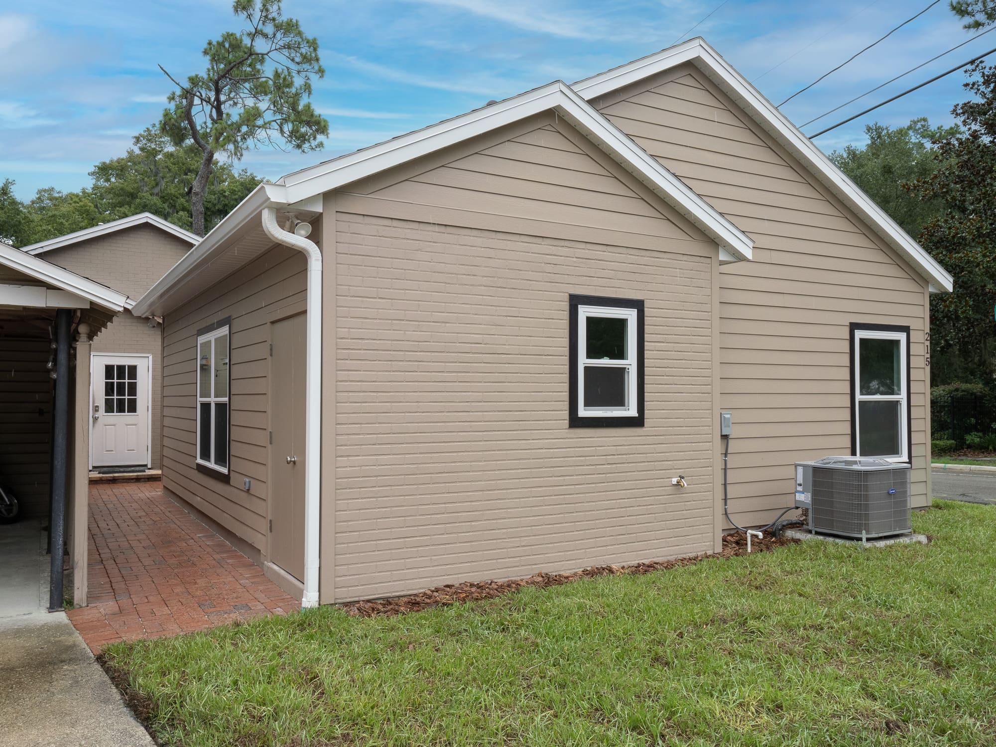 Custom built ADU with brick accents and side patio - Ways to Maximize Space - Robinson Renovations - Gainesville Fl Design Build Remodeler and Custom Home Builder
